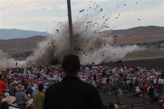 In this Sept. 16, 2011 file photo, a P-51 Mustang airplane crashes into the edge of the grandstands at the Reno Air show in Reno, Nev, leaving 11 people dead and 70 seriously injured.